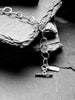 Molten asymmetrical skinny link sterling silver bracelet with single chunky contrasting oval link and T-bar toggle clasp