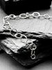Molten asymmetrical skinny link sterling silver bracelet with single chunky contrasting oval link and T-bar toggle clasp