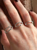Textured silver rings with organic, wavy openwork designs. Oval molten texture silver rings.